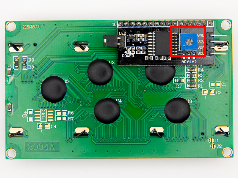 Photo of the back of a 20x4 LCD with the potentiometer contrast adjustment highlighted in red.